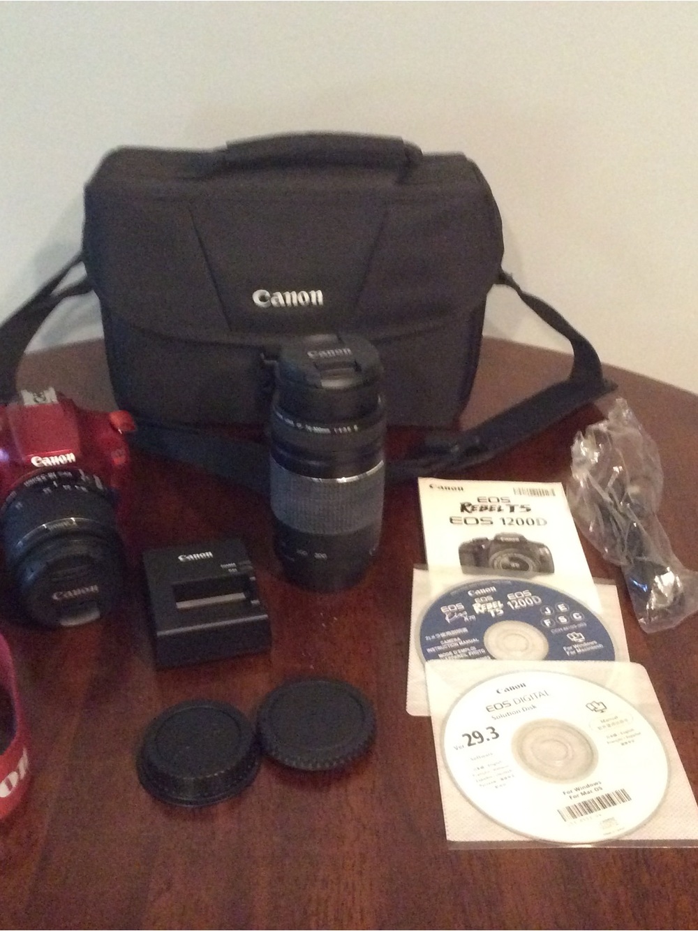 Canon Red EOS Rebel T5 1200 D camera kit.